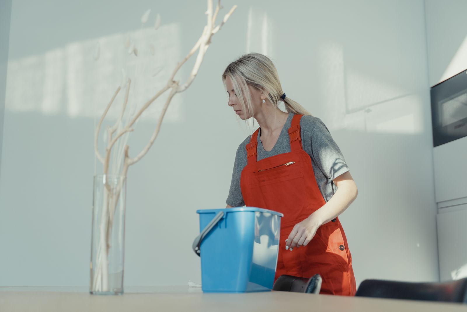 Commercial cleaner with a bucket in an office