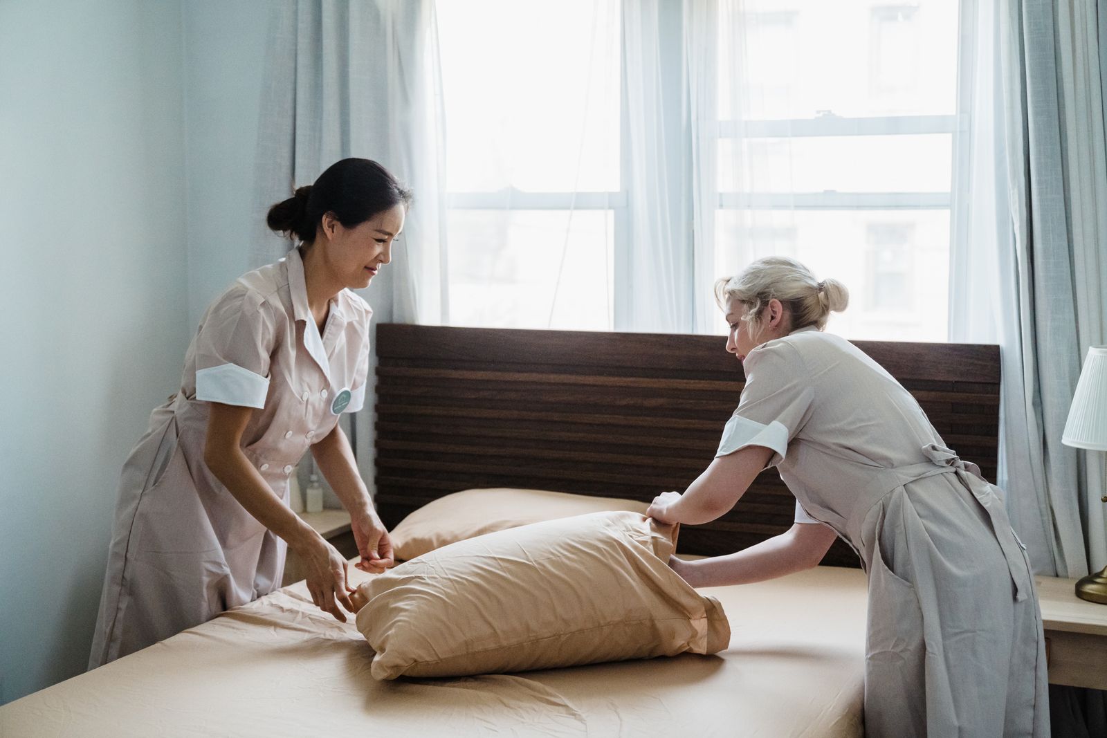 Crisp & Co. housekeepers preparing a bedroom